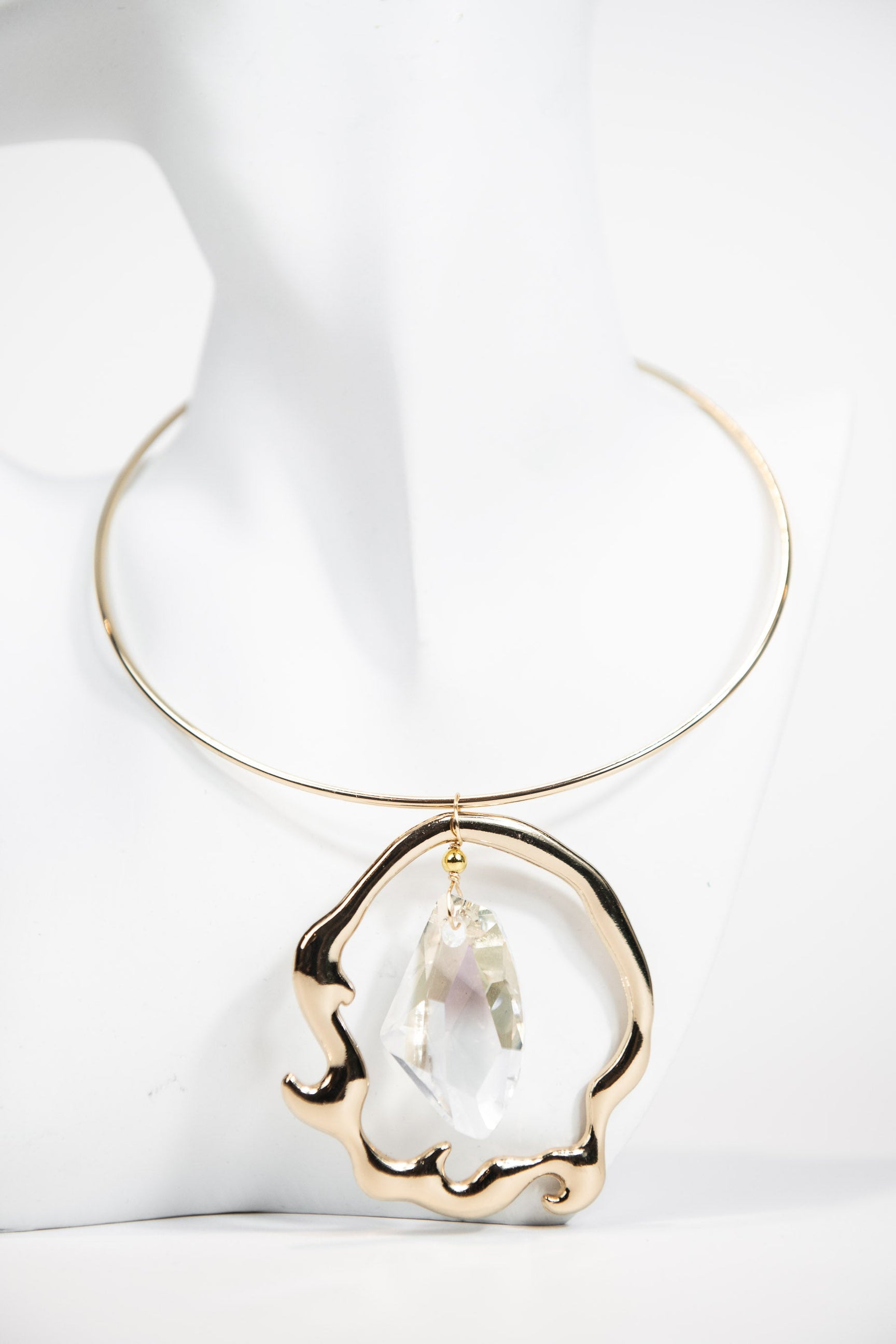 Gold metal collar necklace with organic Swarovski crystal pendant