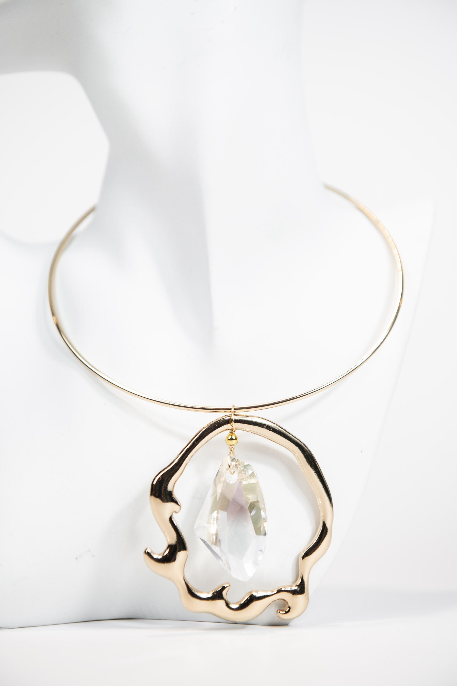 Gold metal collar necklace with organic Swarovski crystal pendant