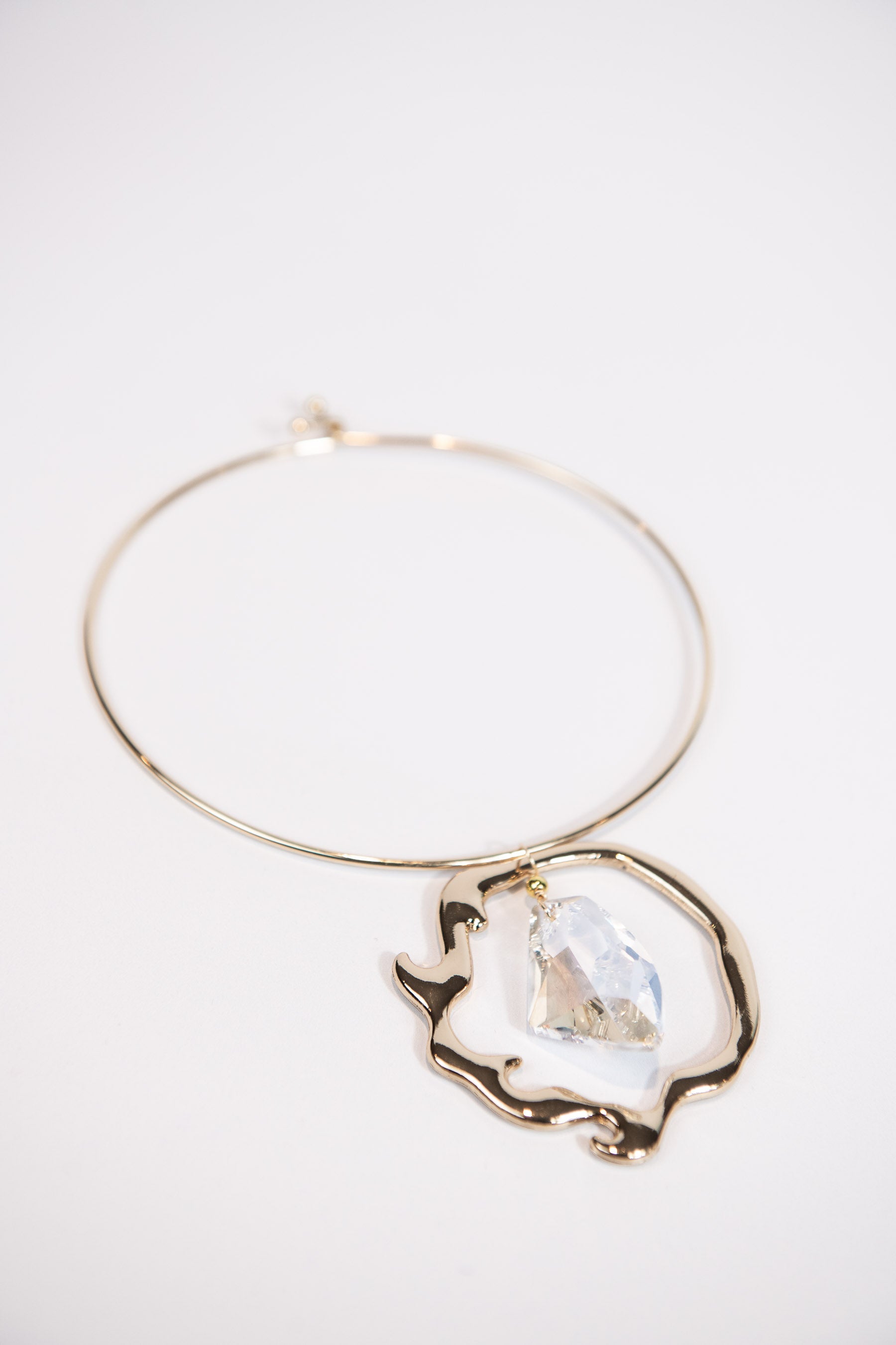 Gold metal collar necklace with organic Swarovski crystal pendant
