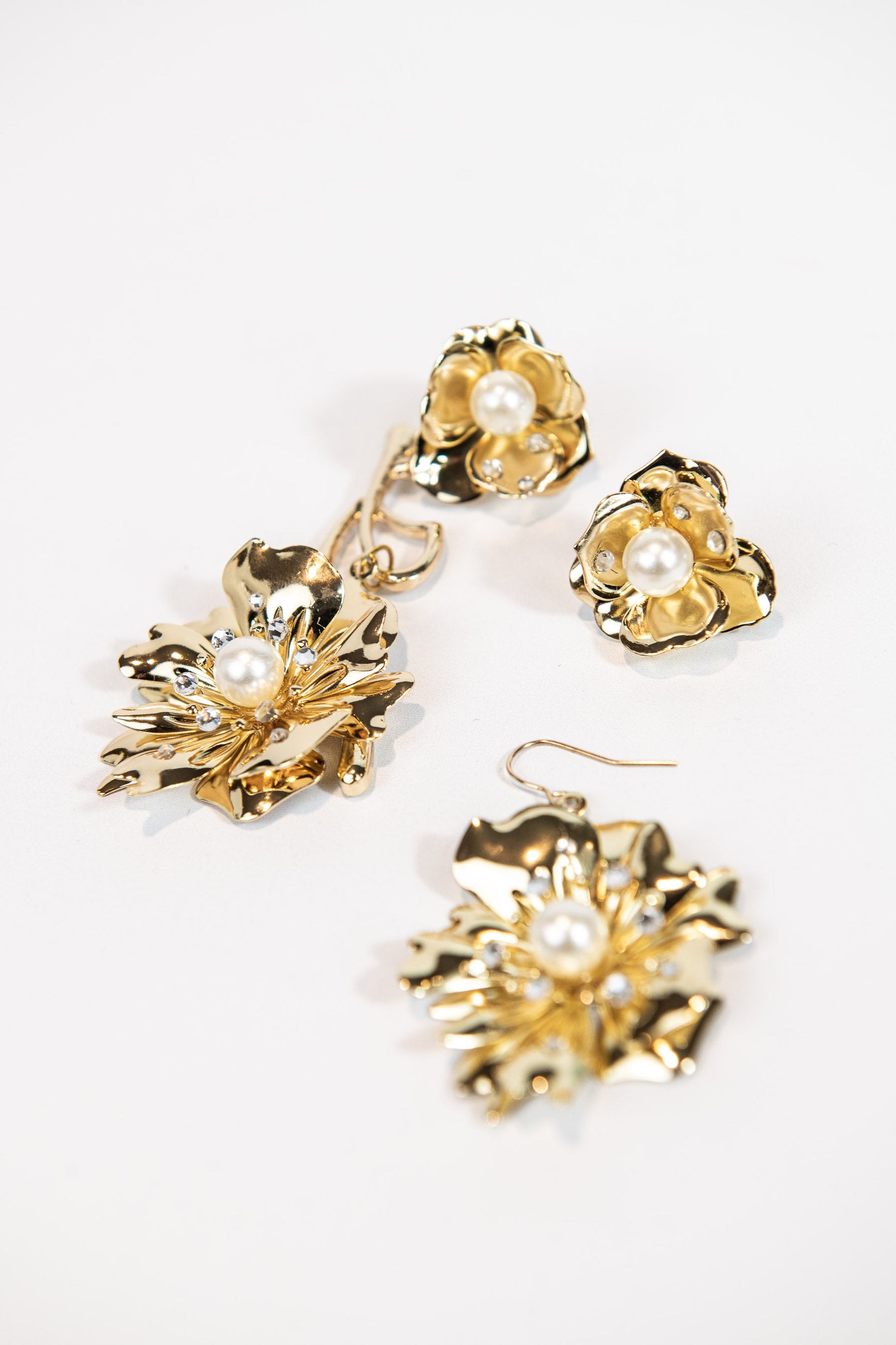 3-piece gold metal asymmetrical pearl and crystal floral earrings with stud or hook options