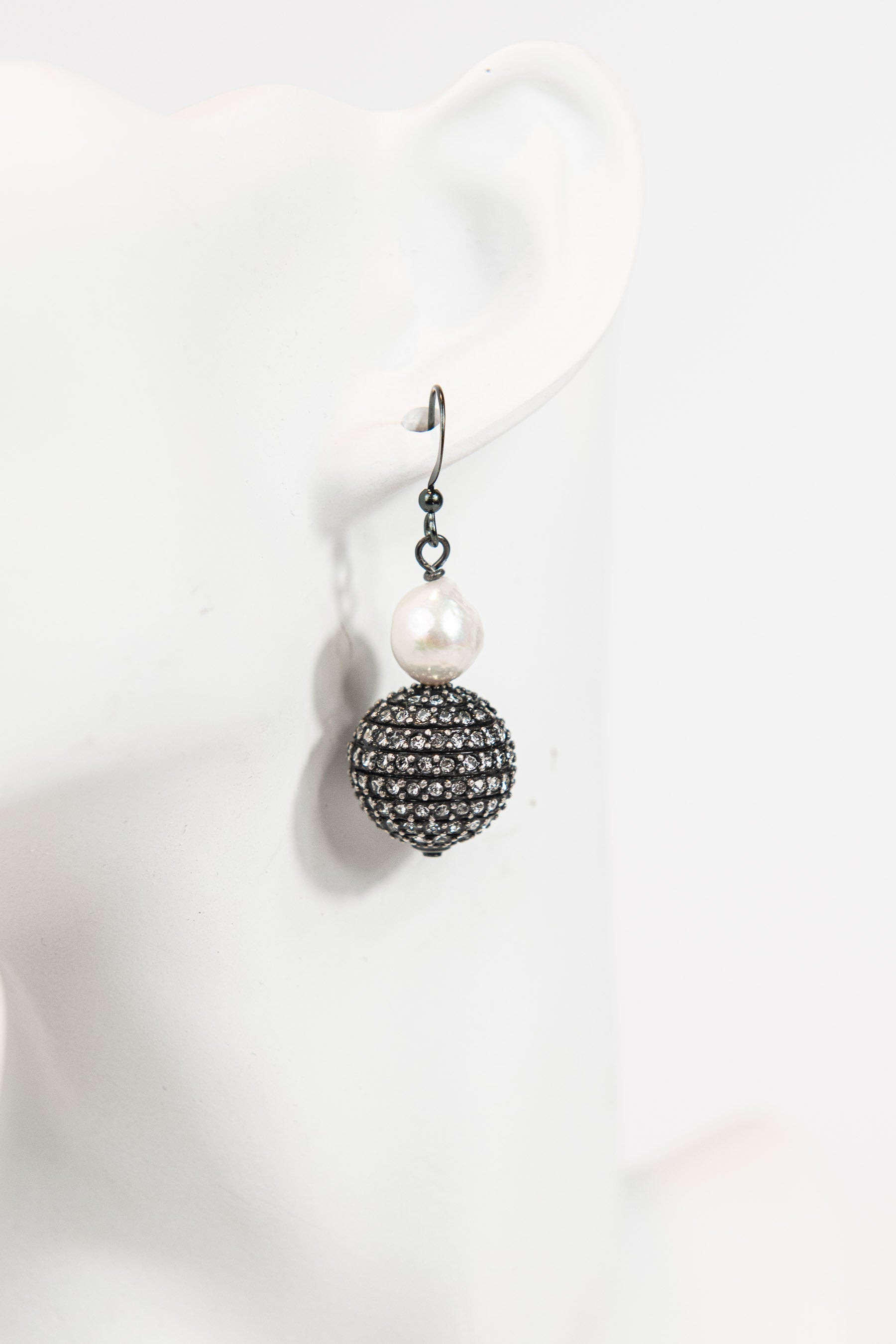 Gunmetal crystal sphere and freshwater pearl drop earrings