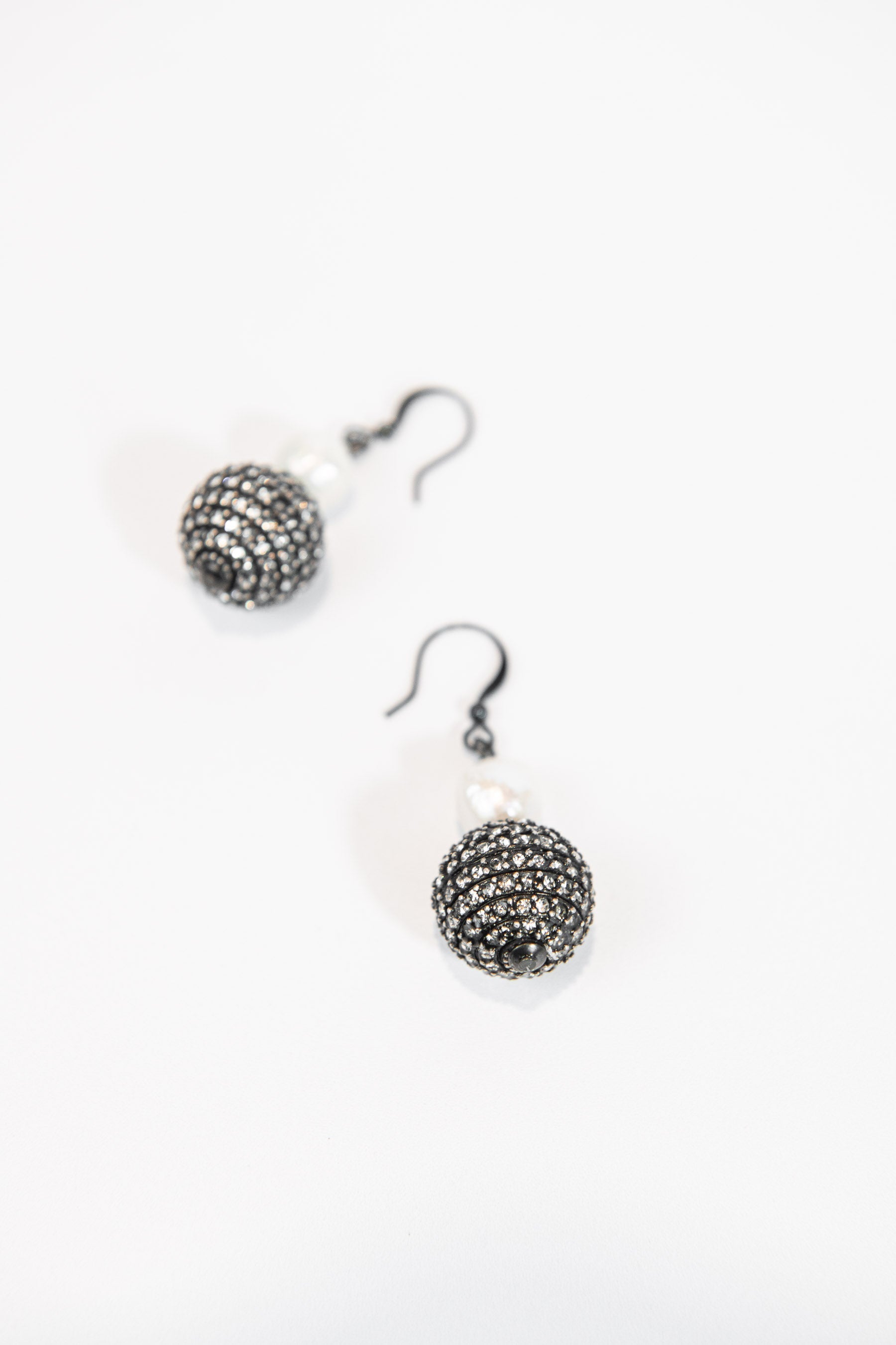 Gunmetal crystal sphere and freshwater pearl drop earrings